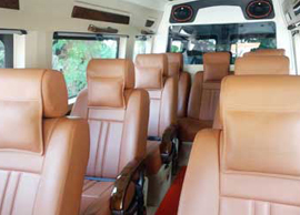 9 seater deluxe 1x1 tempo traveller hire from delhi to allahabad prayagraj